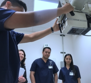 Students working hands-on in a radiology lab in our X-ray Tech program in Orange County
