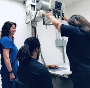 students in our all-inclusive x-ray tech program practice their skills taking digital x-rays